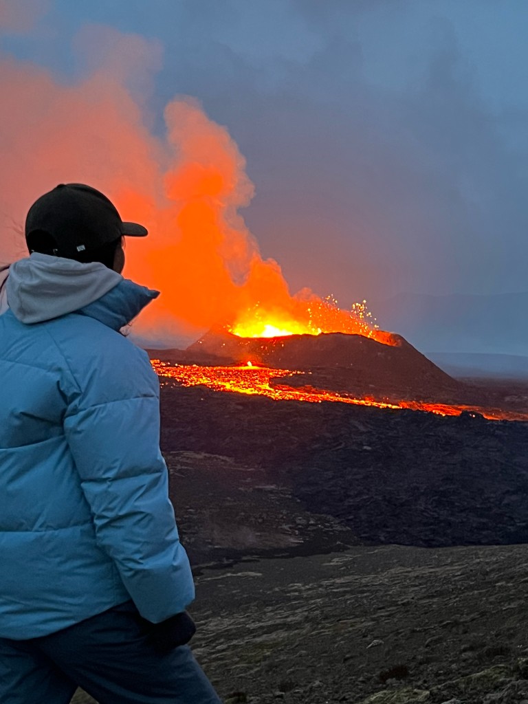 Watching a volcanic eruption with flowing lava